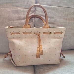 Dooney & Bourke Tan/Pink Hearts purse with handles.